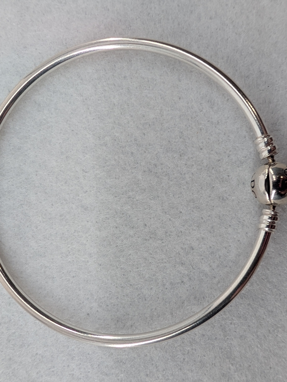 Pandora Moments Logo Clasp Bangle crafted in sterling silver